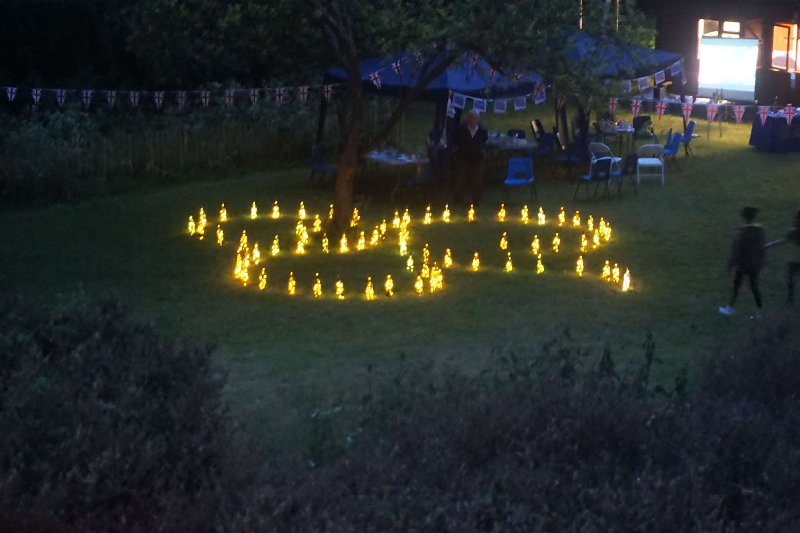 Girlguiding members across the UK lit 70 beacons, one for each year of the Queen's service. Girlguiding Kent West were chosen to light one of the beacons and this took place at Pax Wood, Wilmington. Divisions from across the county including Dartford, Gravesend and Medway joined together to light up a Guiding Trefoil