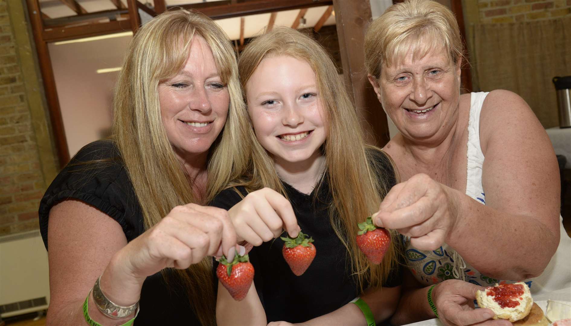 Tracy and Molly Partridge, with Maggie Marwood enjoying a strawberry tea last year. Picture: Chris Davey