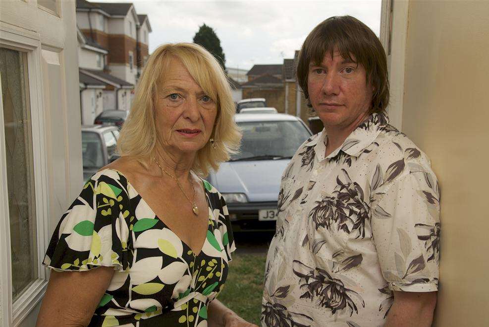 Valerie Whitehouse and her son Julio, with the car stolen from outside their home at Windsor Road, Gillingham