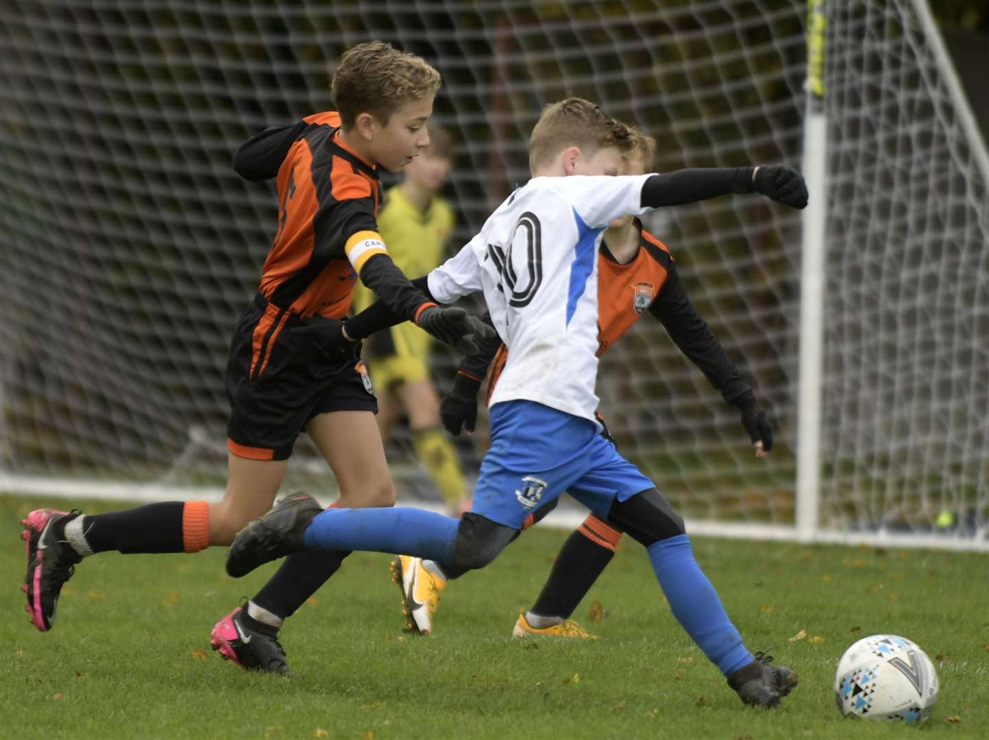 Medway United South under-11s (white) are closed down by Lordswood Youth under-11s. Picture: Barry Goodwin (42845076)