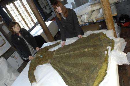 Susannah Mayor and Steph Poyton working on a dress worn by Ellen Terry while paying Guinevere at the Lyceum Theatre in 1895