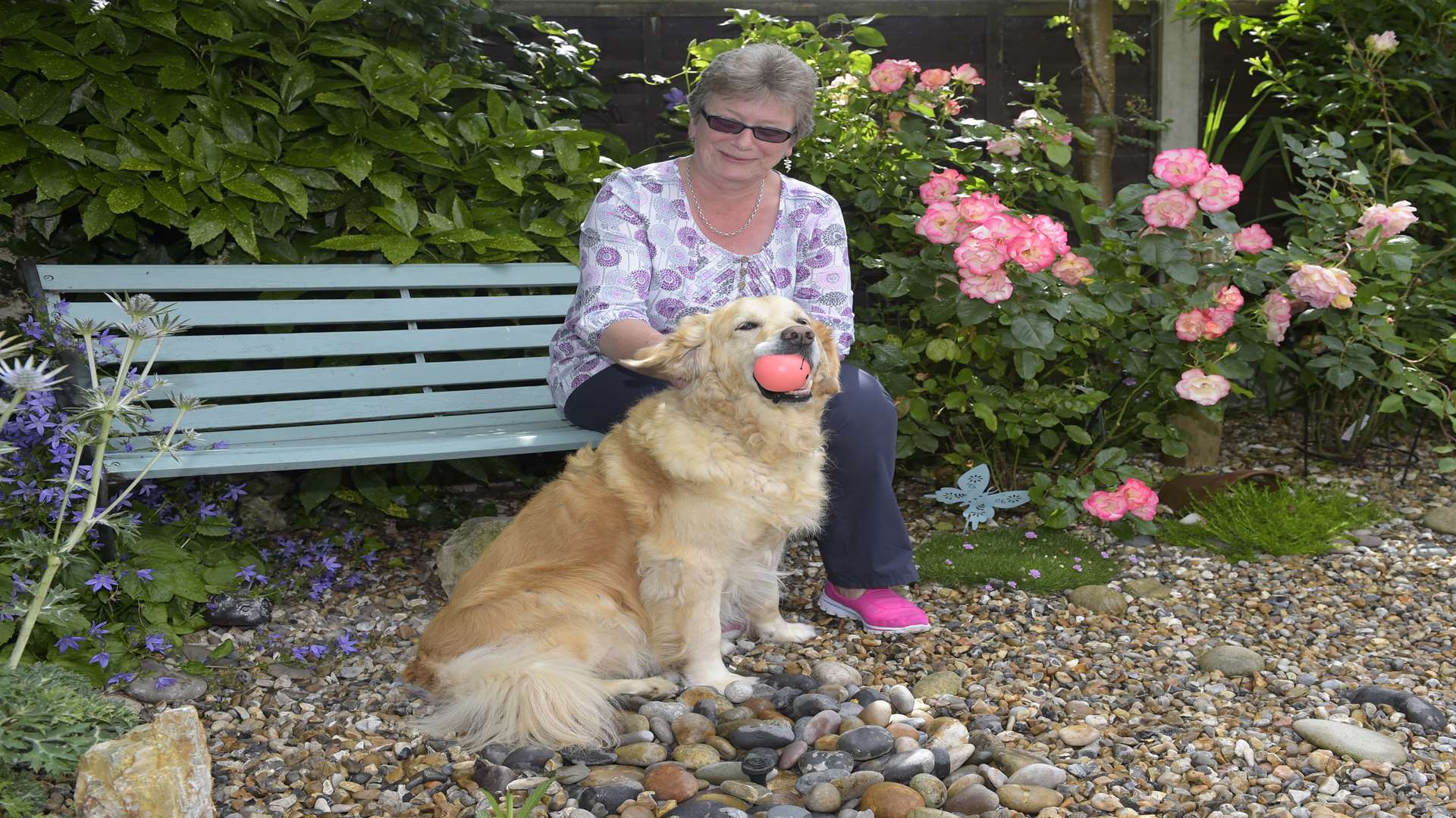 Jan Ware with her dog Lady in her garden in West Lea, Deal.