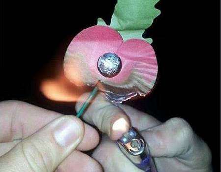 Linford House posted this picture of a poppy being burned with a lighter on Facebook