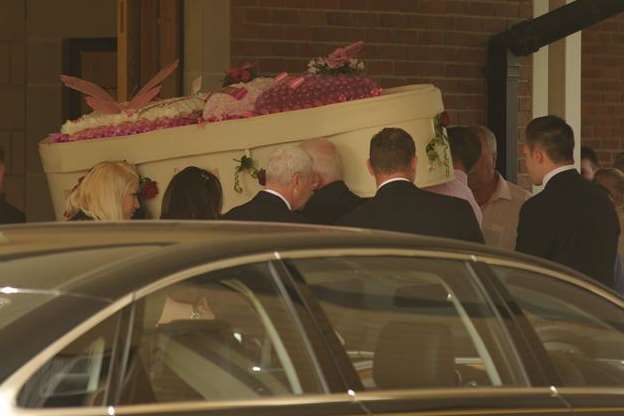 The coffin of Jade Glen is carried into the Garden of England Crematoriam in Bobbing