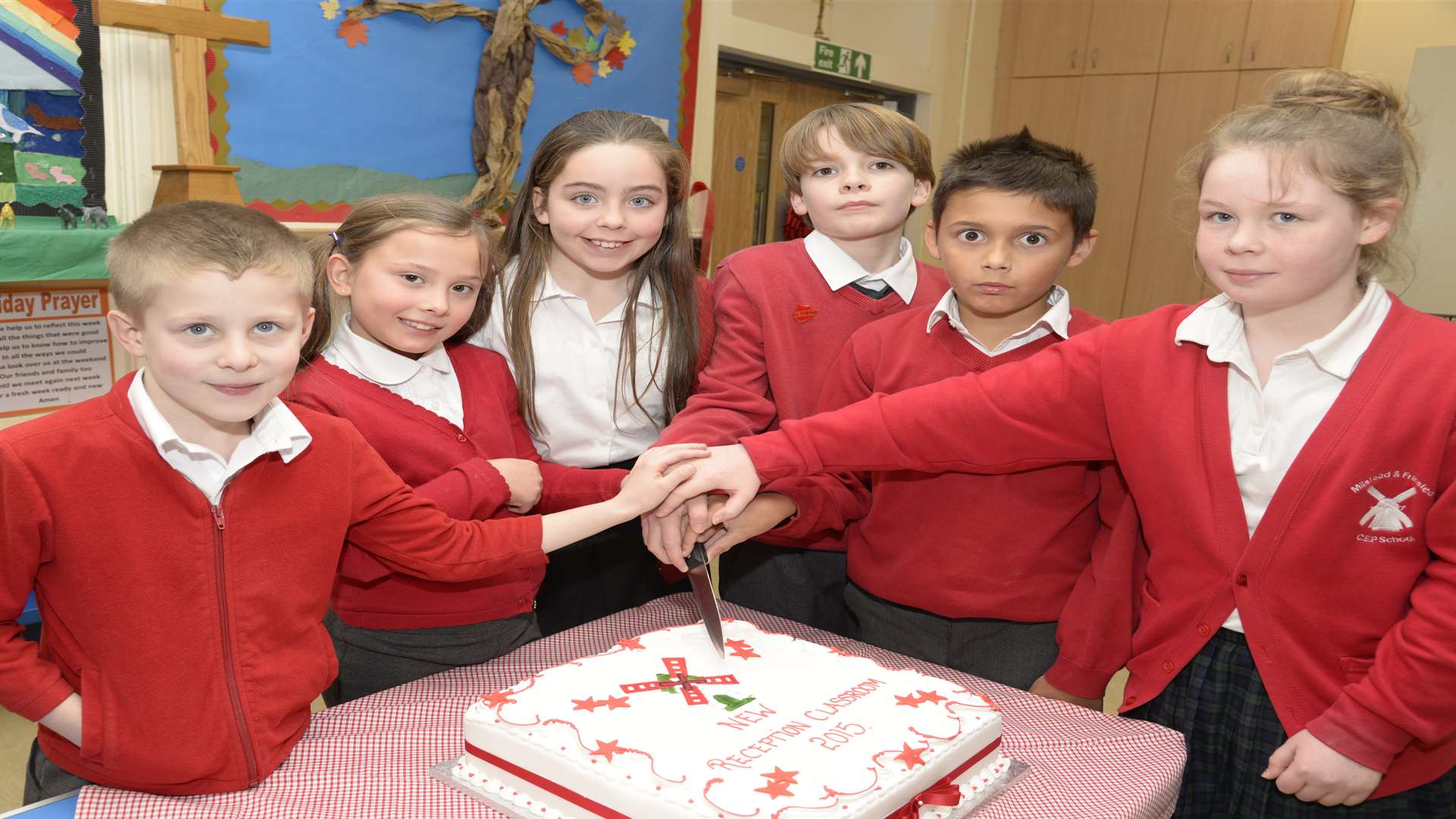 Members of the School Council cut a cake to mark the event