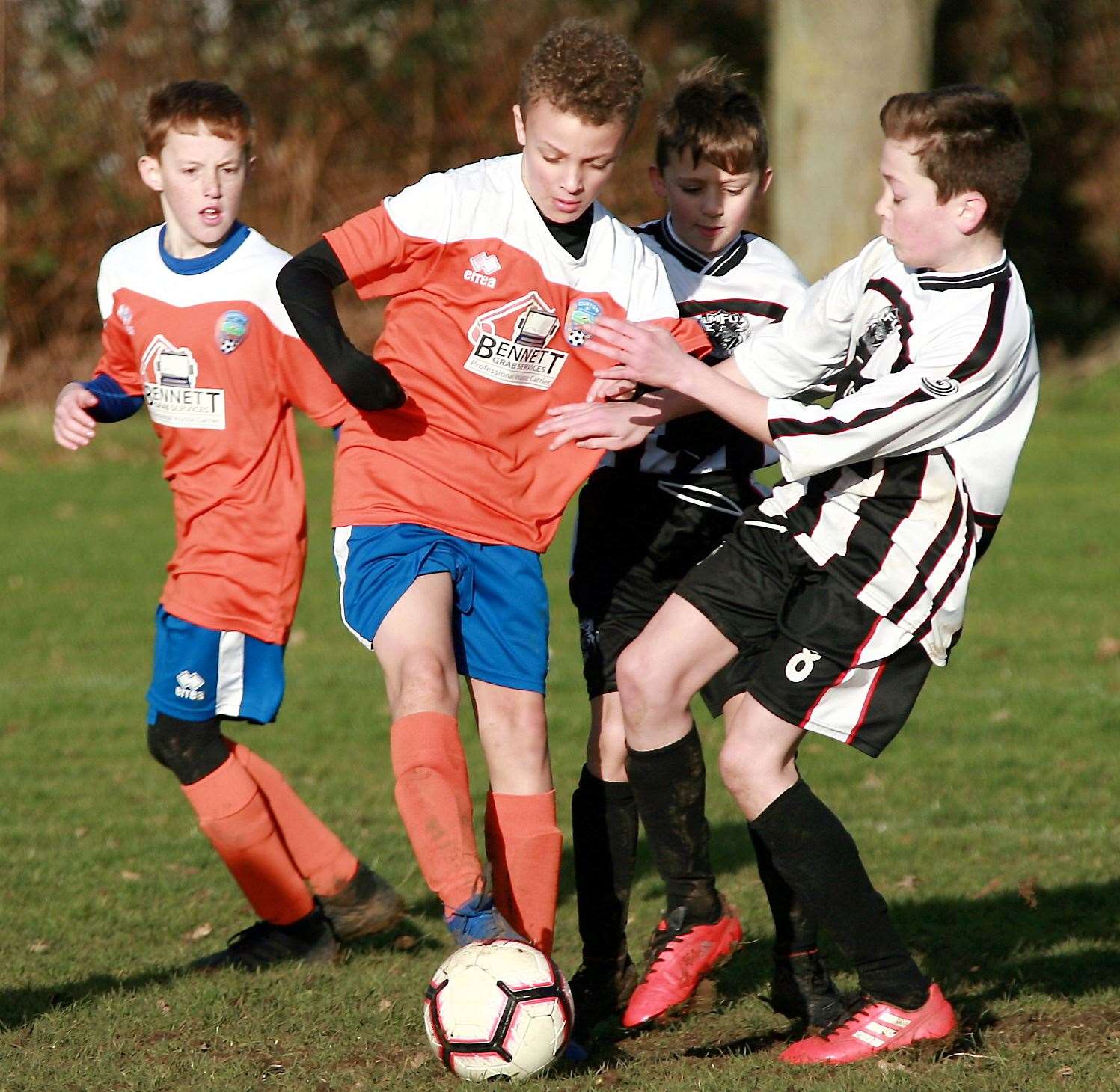 Cuxton 91 Dynamos under-12 (orange) take on Milton and Fulston United Zebras under-12s. Picture: Phil Lee FM26563351