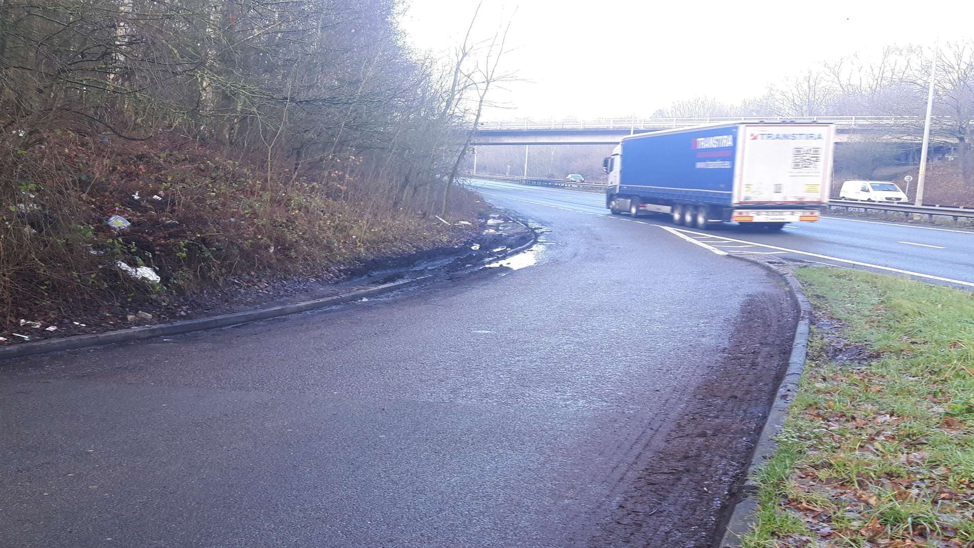 A lay-by on the A2 where three men died after a crash involving a lorry.