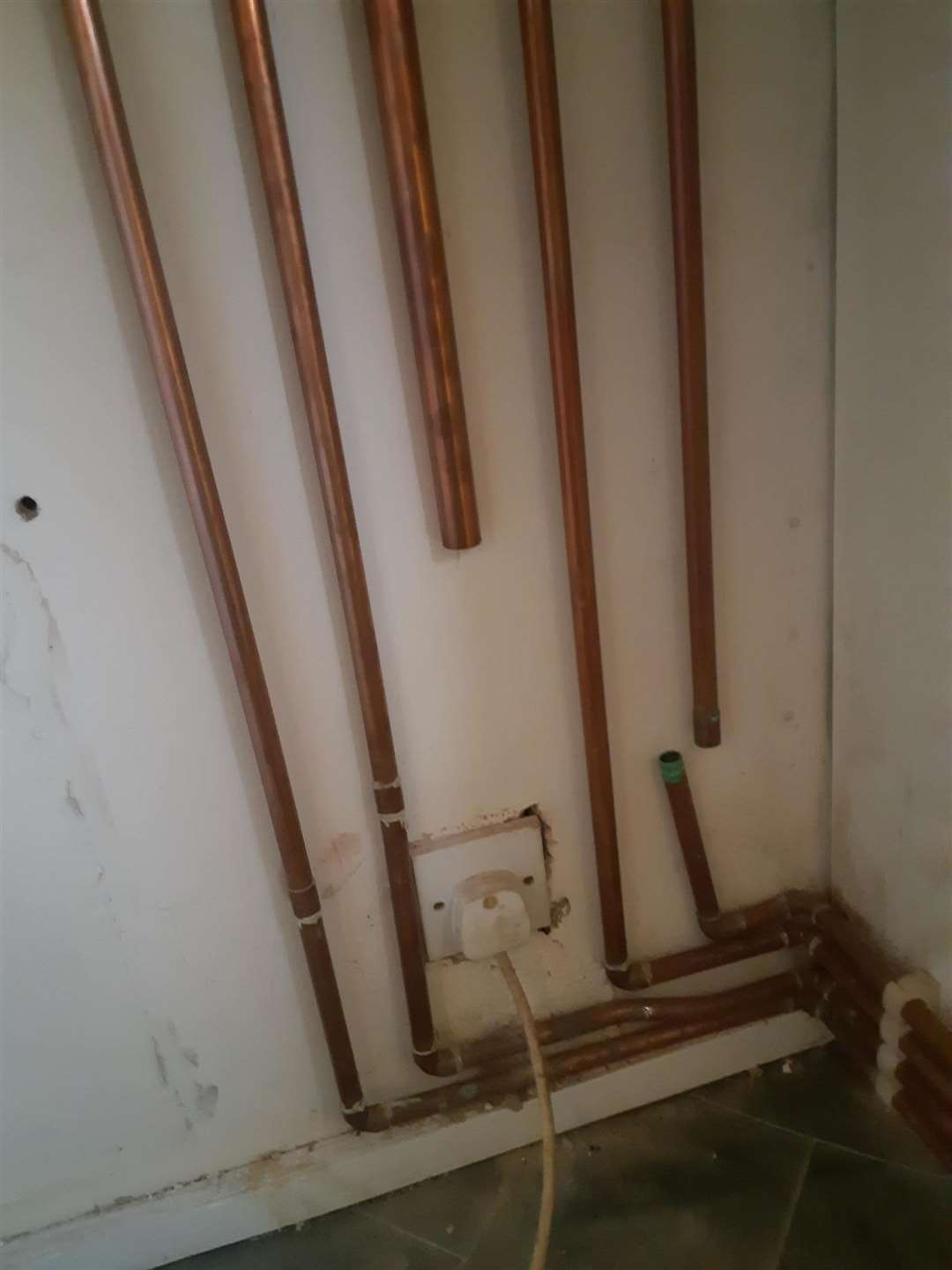 Unfinished pipe work in her flat