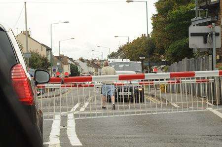 Man clears level crossing... just before train approaches.