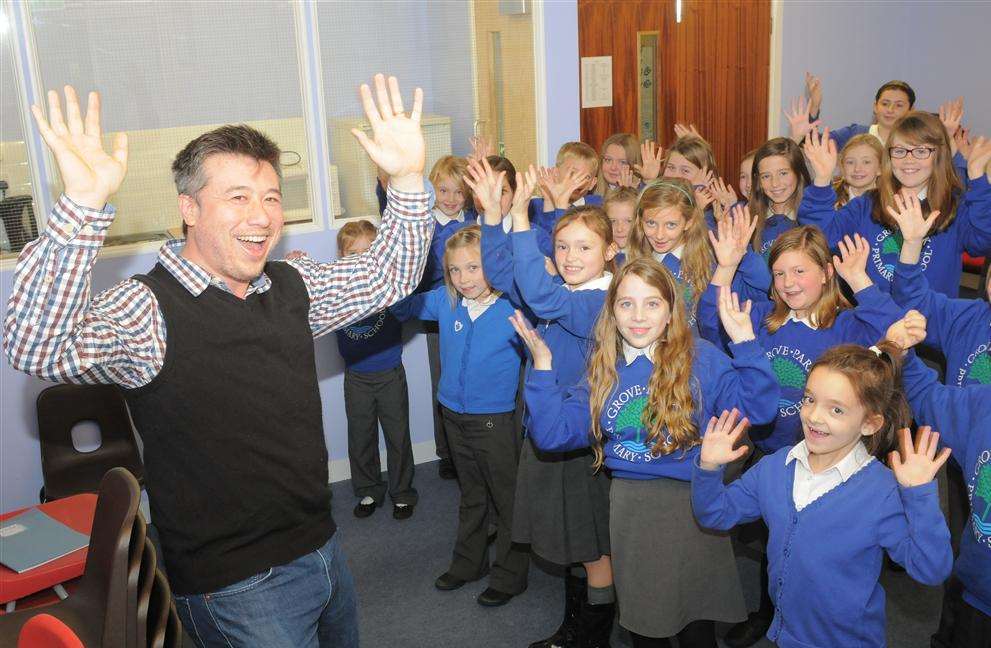 John Quinn with Grove Park primary pupils