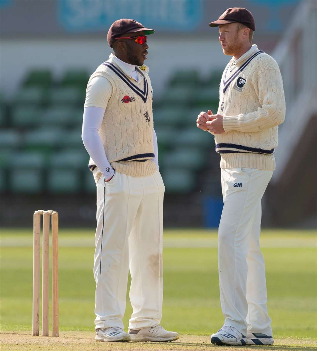 Adam Riley, right, talks to acting skipper Daniel Bell-Drummond during the game against Loughborough MCCU at Canterbury Picture: Ady Kerry