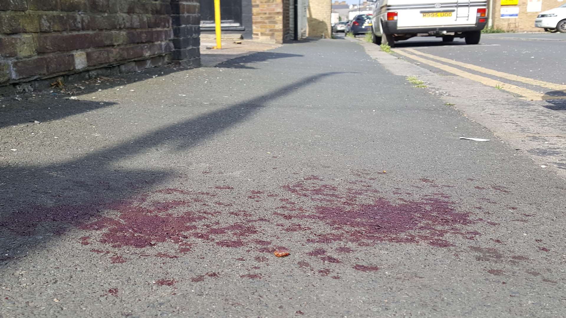 Blood on the pavement following the alleged attack