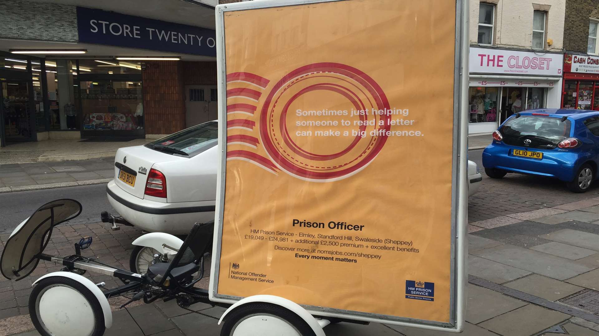 An advert for prison officer jobs being cycled around Sheerness