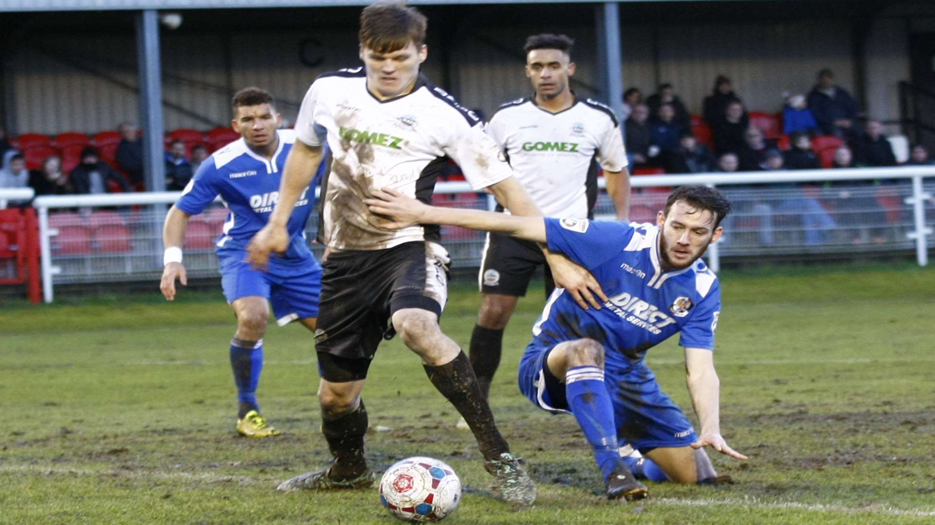 Sean Raggett in the thick of the action against Dartford earlier this season