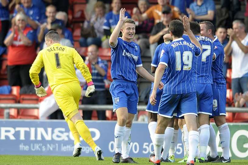 Adam Barrett celebrates with fellow Gills players after scoring the third goal against Crewe. Picture: Barry Goodwin