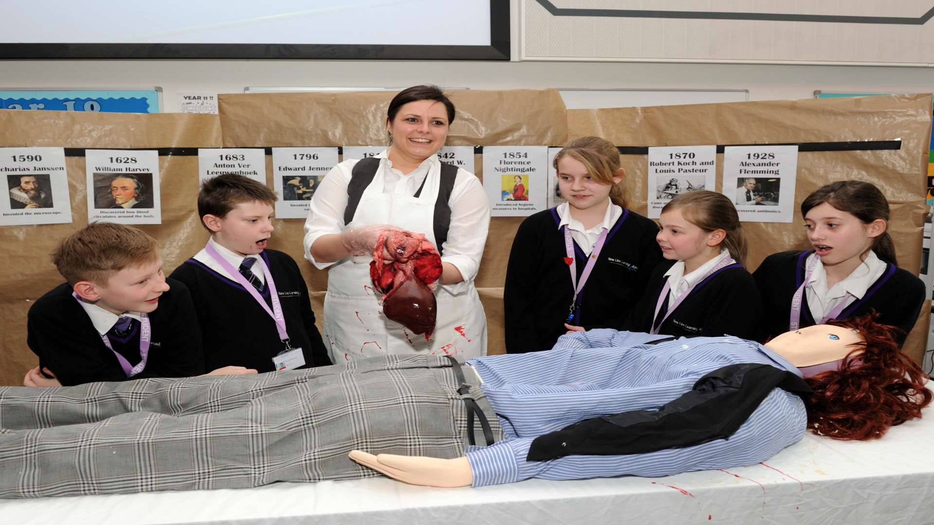 Science teacher Rebecca Holness with pupils Shay Fitzmaurice, Declan Roberts, Abbi Tritton, all 12, Sapphire Gaskin and Holly May Stevens, both 11, at New Line Learning Academy's historic surgery
