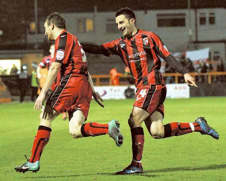 Charlie Lee celebrates scoring Gillingham's winning goal at Barnet with fellow on-loan player Chris Whelpdale.
