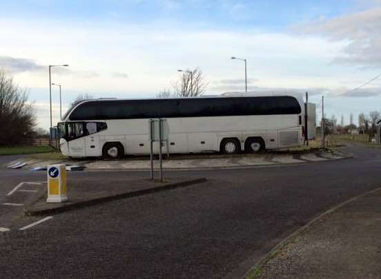 And the next stop is....a coach stuck on the roundabout at Brookland.