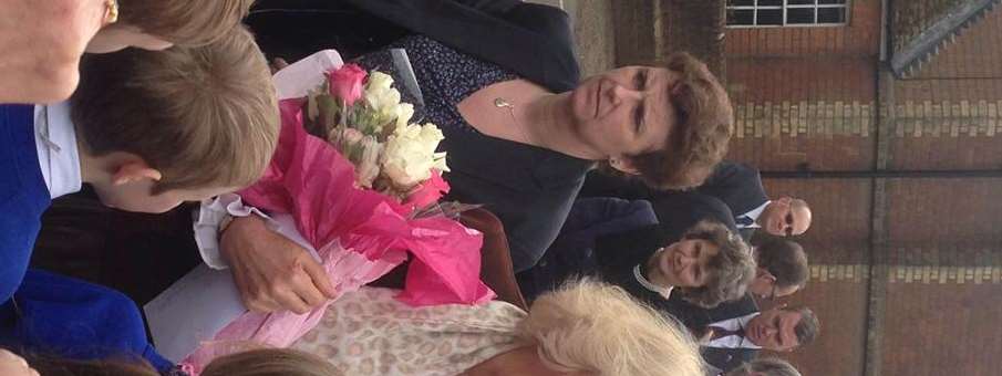 The Duchess of Cornwall with flowers given to her by children in Yalding