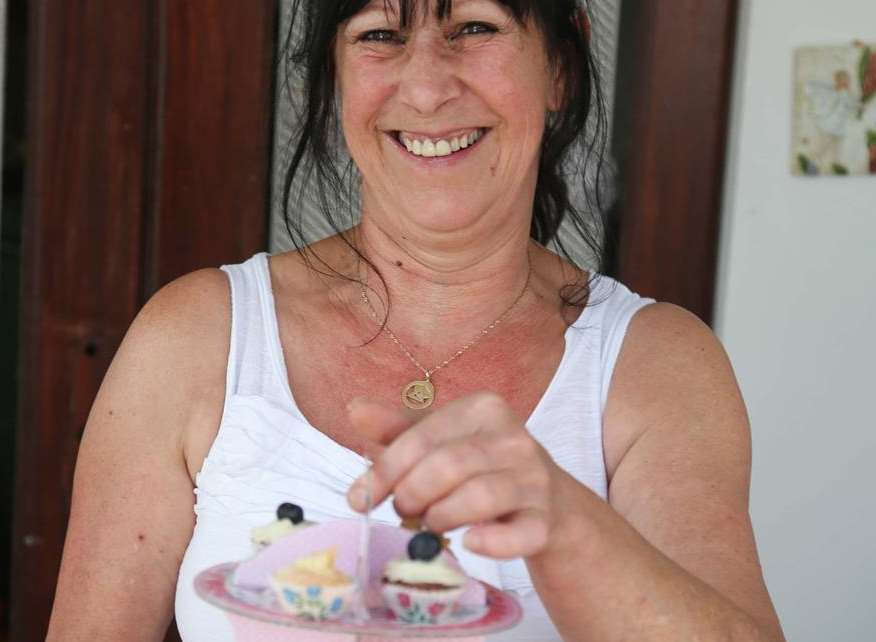 Julie Murby serving cakes at Harmony Therapy Trust's annual high tea