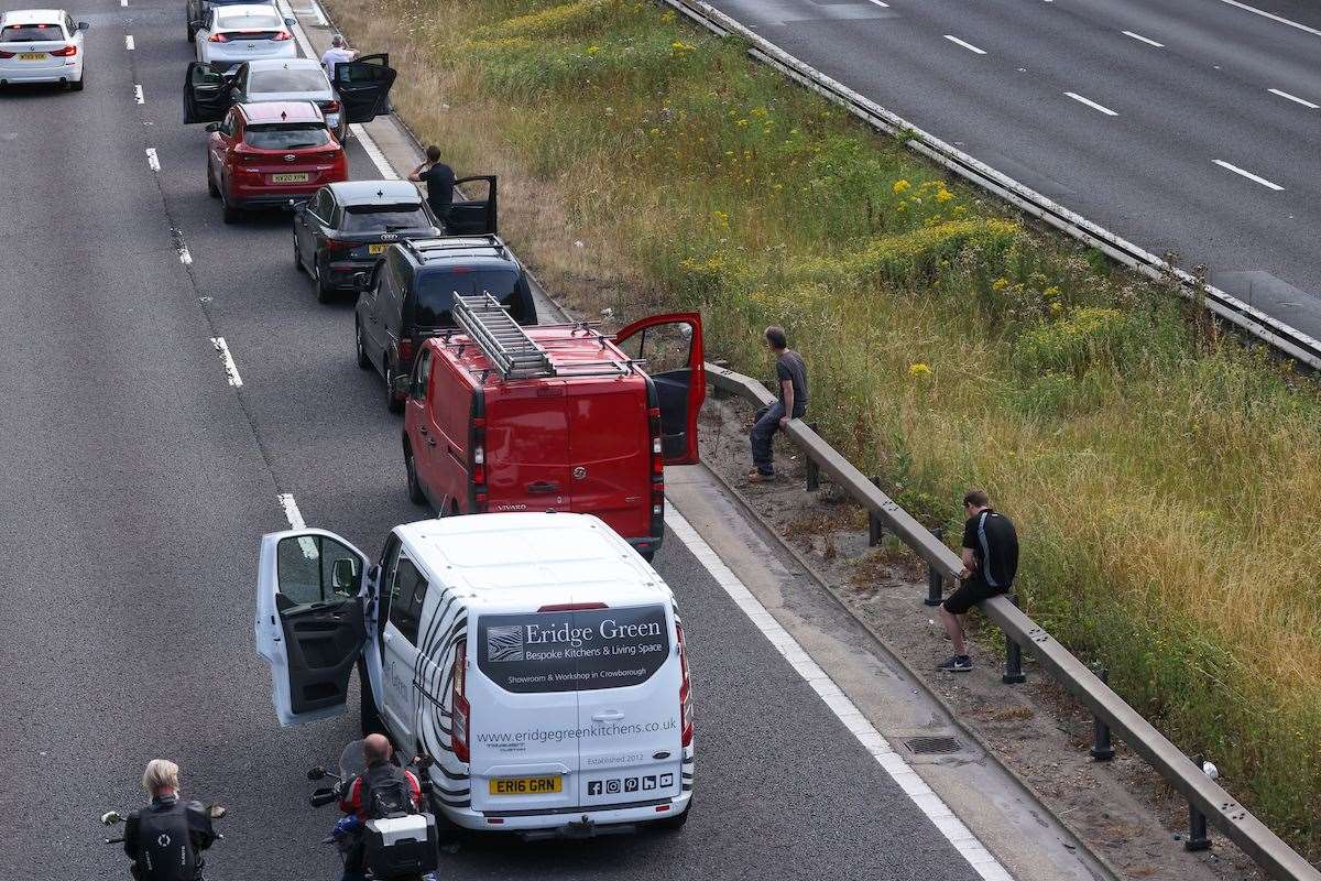 Drivers were out of their vehicles after being caught up in the aftermath of the tanker fire on the M25. Picture: UKNIP
