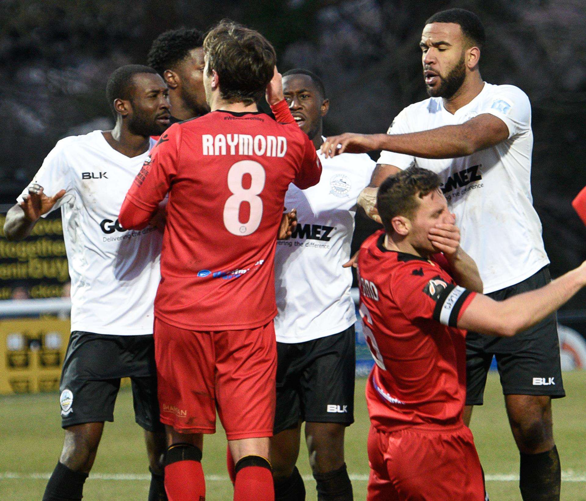 Bromley's Jack Holland goes to ground during the incident which led to red cards for Bedsente Gomis and Kevin Lokko, right Picture: Alan Langley