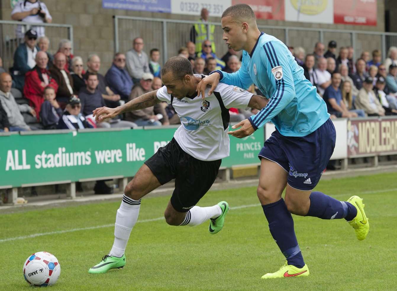 Man-of-the-match Luke Daley holds off Telford defender Rod McDonald Picture: Andy Payton
