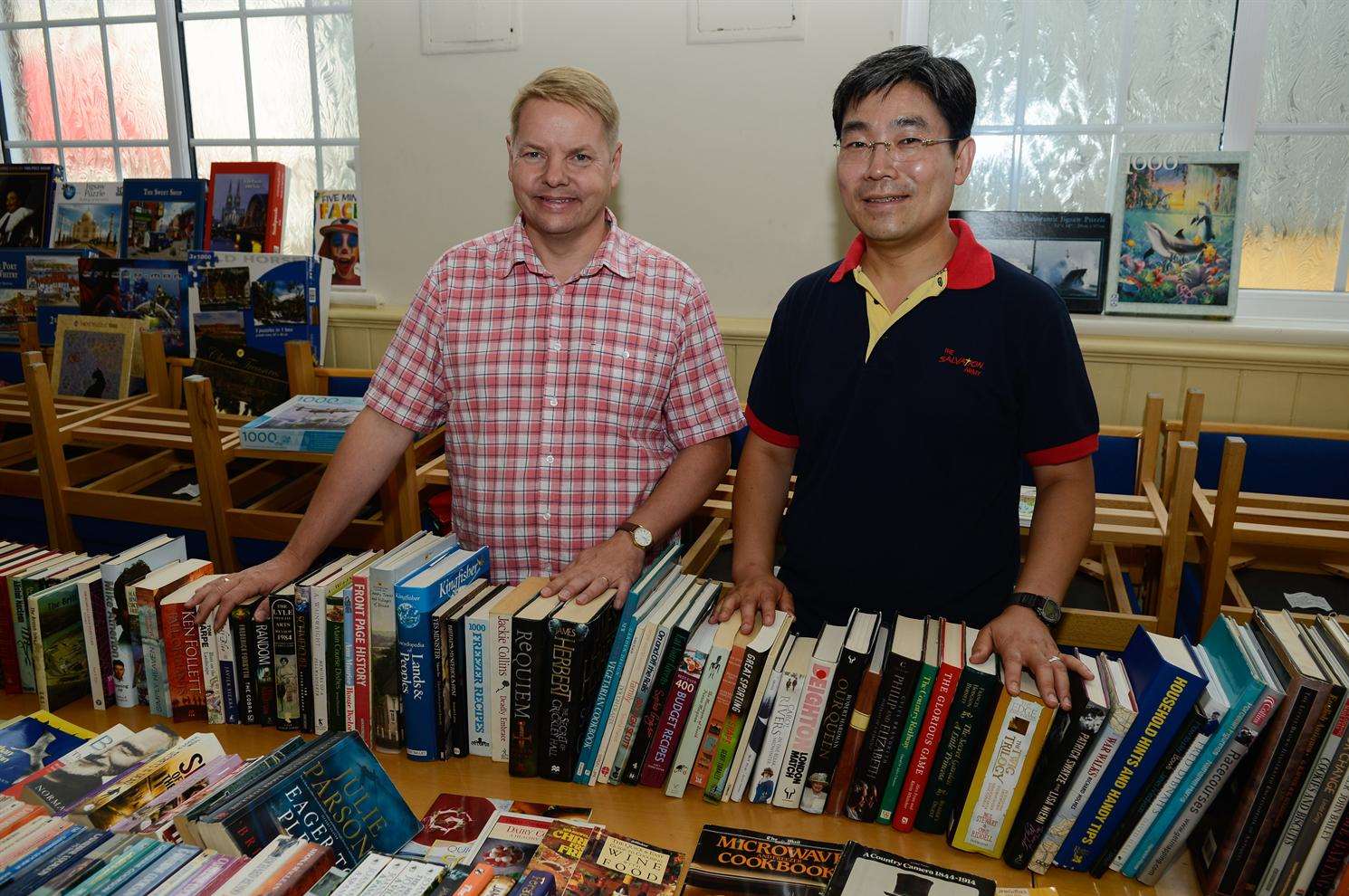 Kook-Hwan Rho and Stephen Windsor running the book stall at the Salvation Army Summer Fair. Donations are needed for the Christmas dinner fundraising fair in November