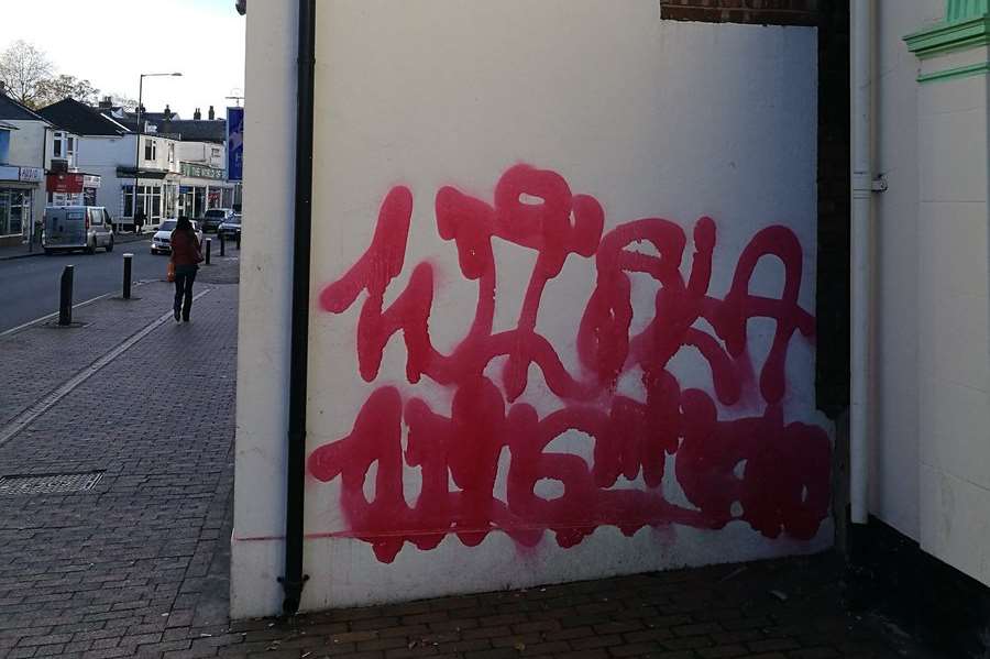 The large pink letters were sprayed on about 20 buildings. Credit: Caroline Auckland