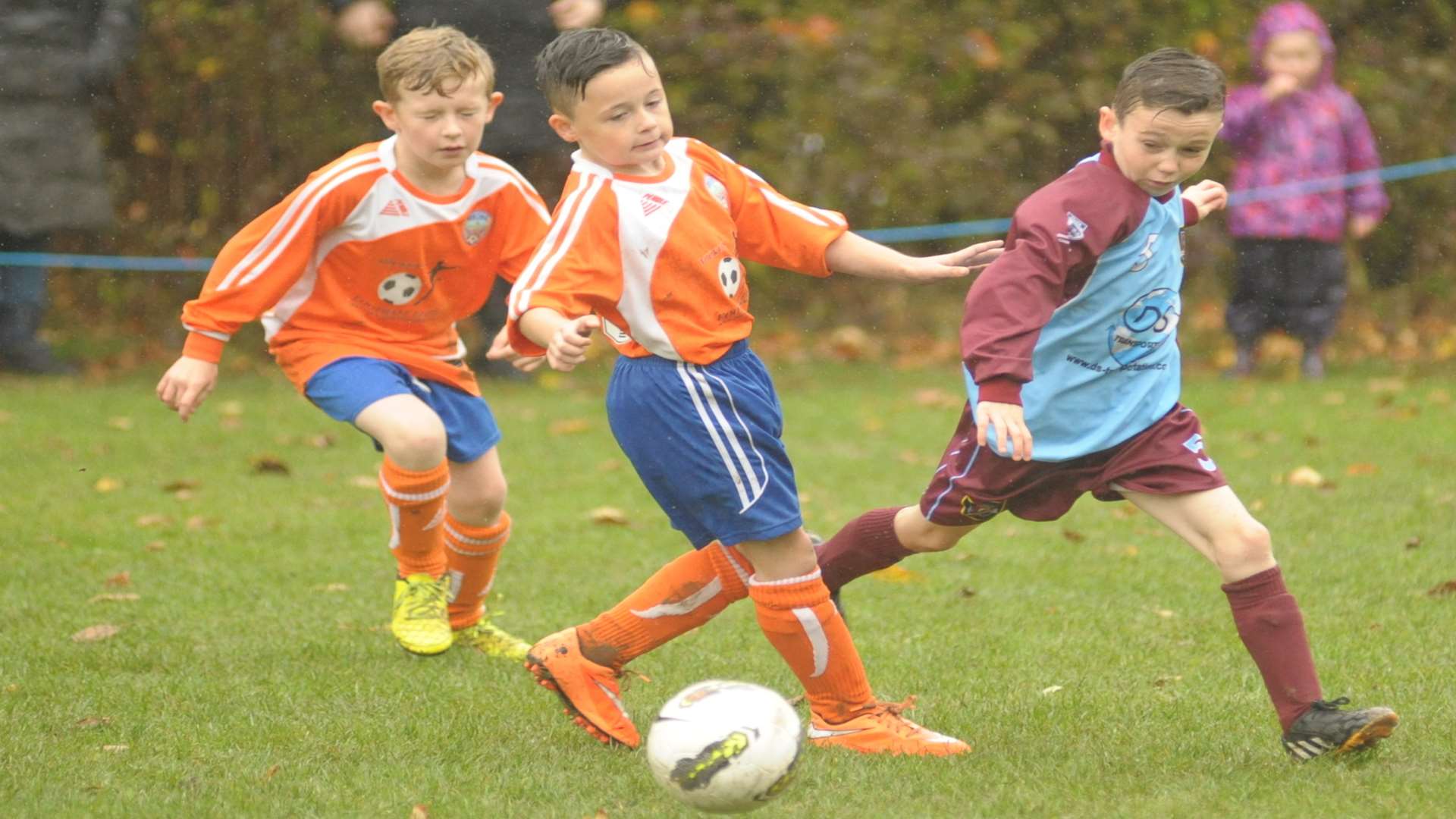 Under-9 sides Cuxton 91 Villa (orange) and Wigmore Youth battle it out. Picture: Steve Crispe
