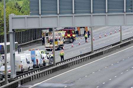 Emergency workers at the scene after a horsebox overturned on the M20