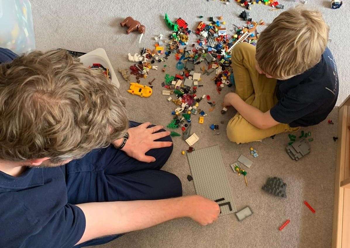 Williamd Durrant and son Freddie filming their LEGO movie scenes for a staff quiz