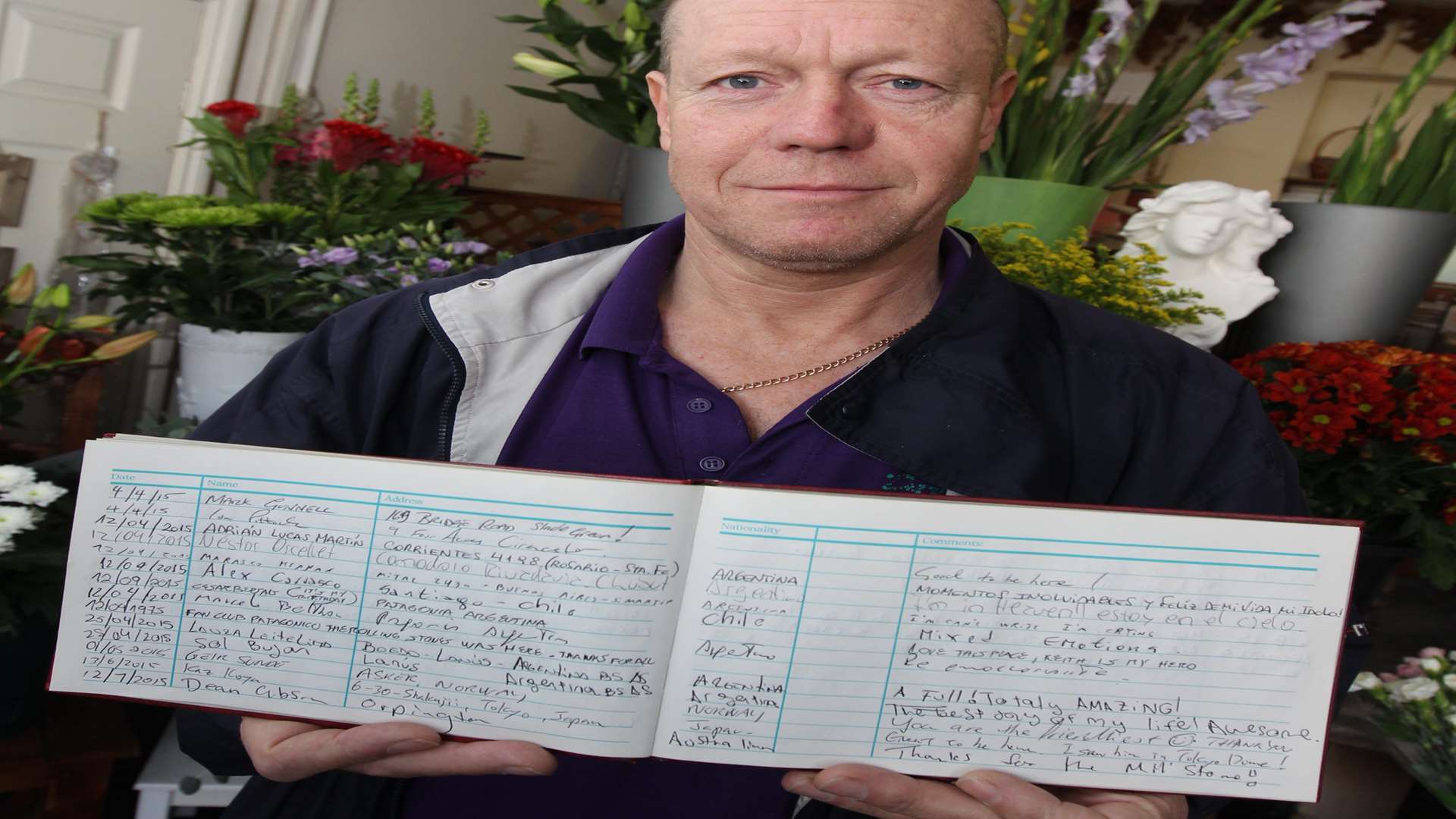 Andrew Dellow, co-owner of The Darling Buds of Kent florist with a visitor book