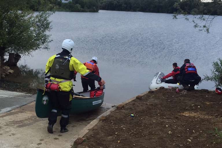 Rescue teams enter the water this morning