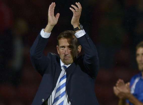 Gills boss Justin Edinburgh salutes the travelling fans at Bradford Picture: Barry Goodwin