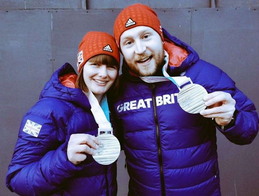 MIllie Knight and guide Brett Wild with their silver medals from the Winter Paralympics in 2018