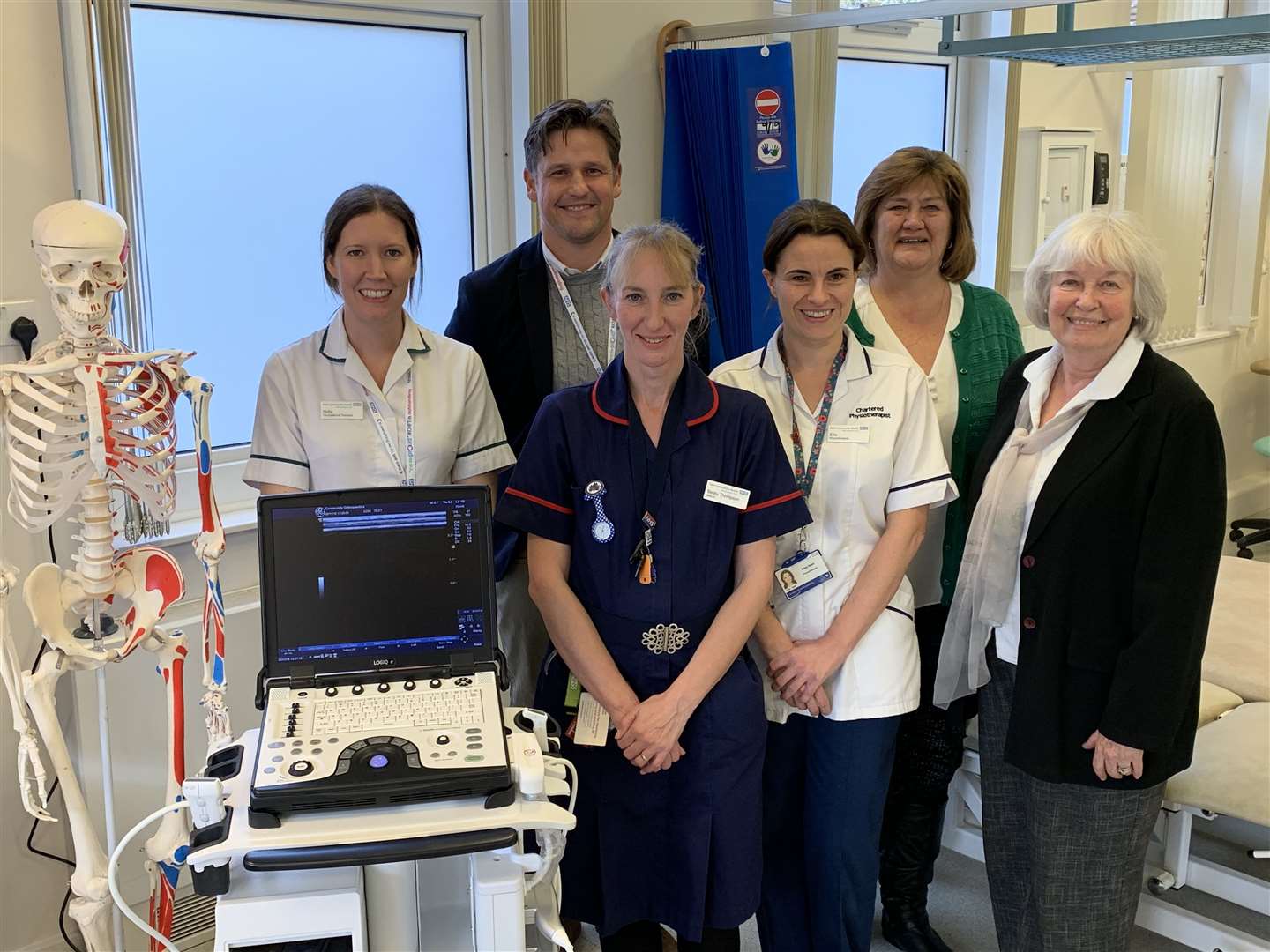 Staff gather round one of the new ultrasound machines for Edenbridge