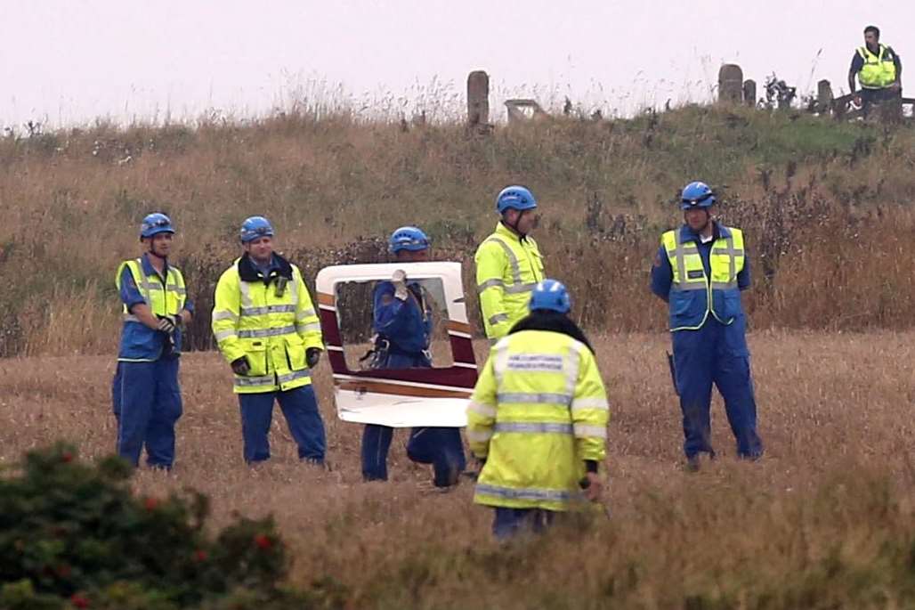 A piece of the helicopter is taken away by rescue crews. Picture: rossparry.co.uk/Steven Schofield