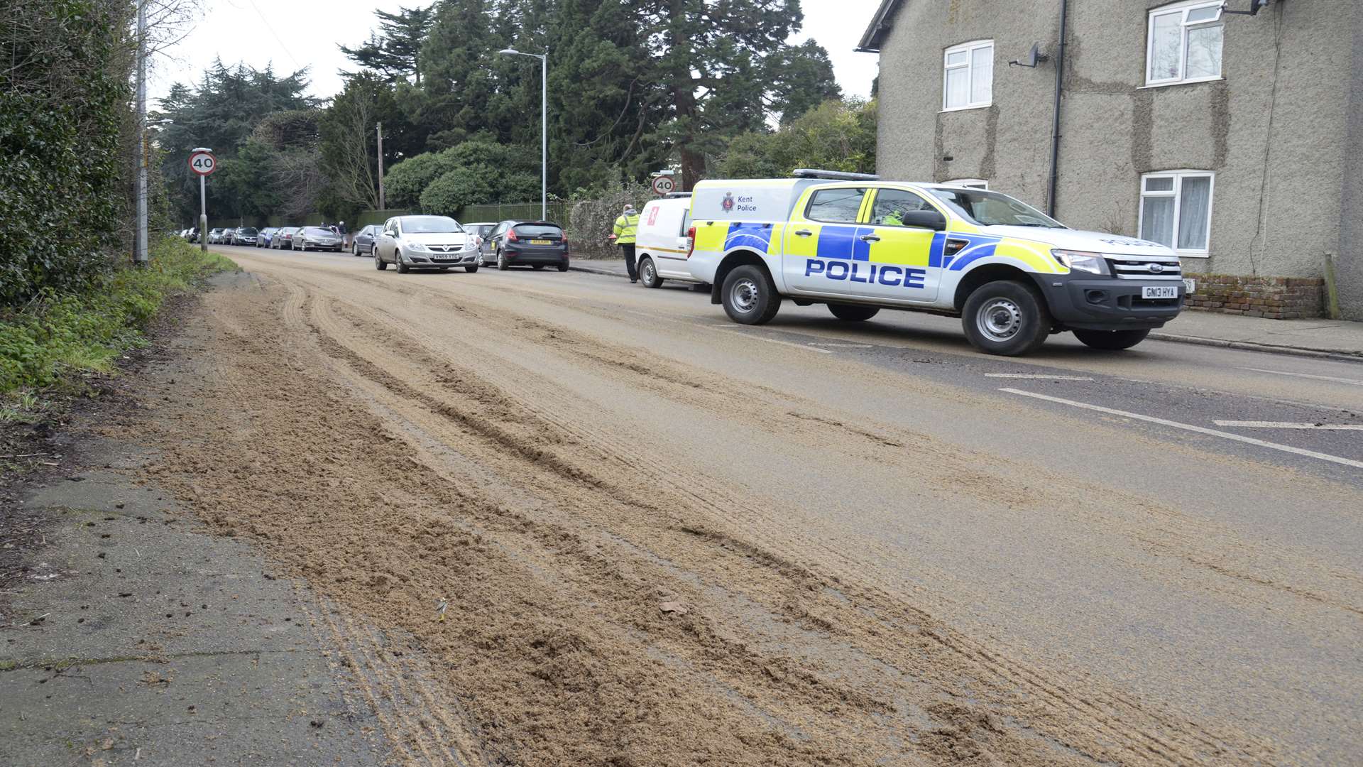 Police at the scene after lorry shed its load