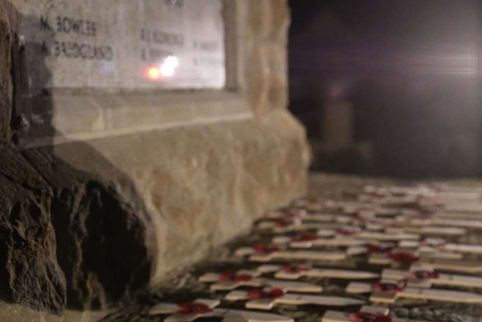 Crosses laid at the foot of the memorial. Picture by Antony Rowse
