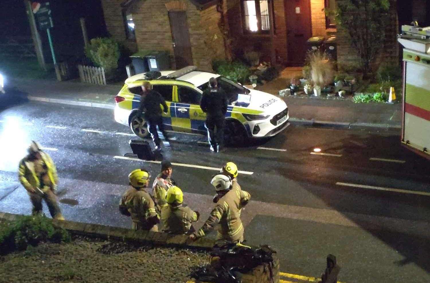 Police officers alongside fire crews in Holborough Road. Picture: Bam Savage