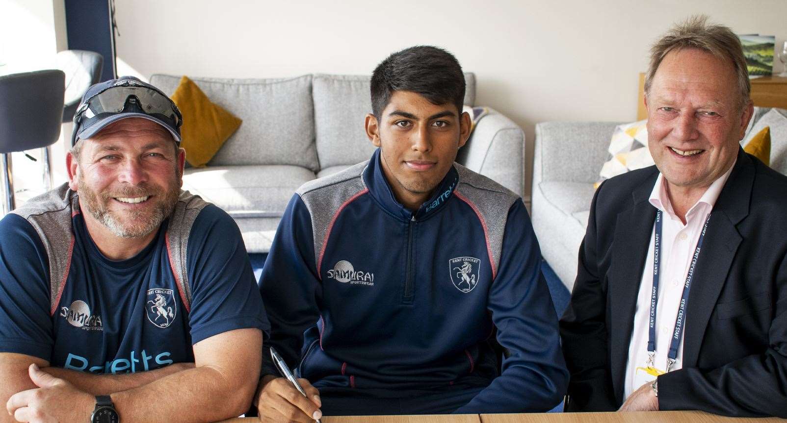 Teenage seam bowler Jas Singh, centre, has signed a professional contract with Kent. He is pictured with head coach Matt Walker and director of cricket Paul Downton. Picture: Kent Cricket