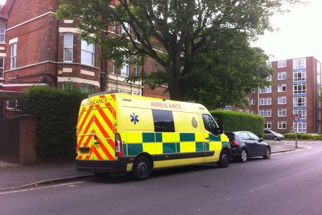 An ambulance remains in Bouverie Road West after a body was found at a flat earlier today. Picture: Peter Phillips