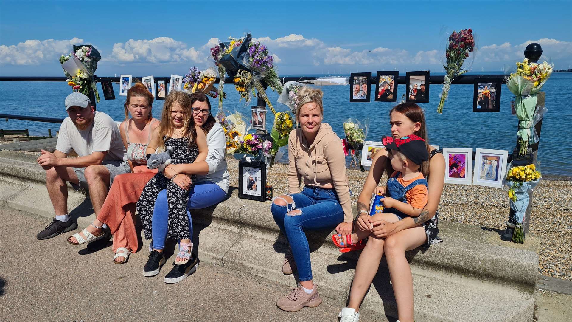 Some of Toby Barrowcliff’s loved ones at the scene of his death in Herne Bay, where flowers have been laid by wellwishers