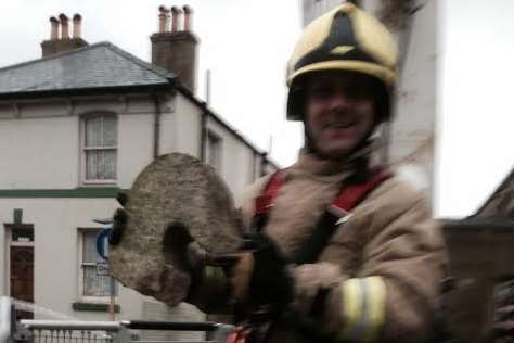 Firefighter Dan Upton, with remains of the concrete angel