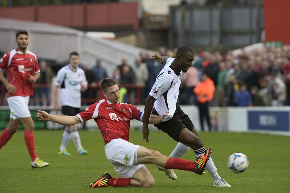 Paul Lorraine tackles Dartford's Uche Ibemere Picture: Andy Payton