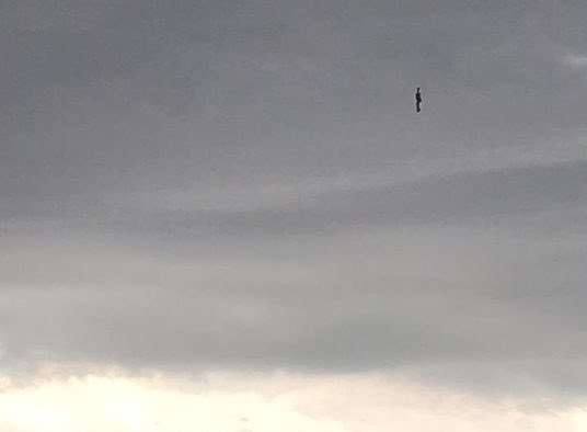Mark Taylor took pictures of what appears to be a figure floating in the sky