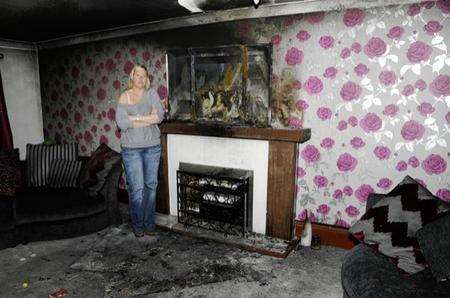 Amanda McLaren in her living room and the blackened surrounds in Willesborough.