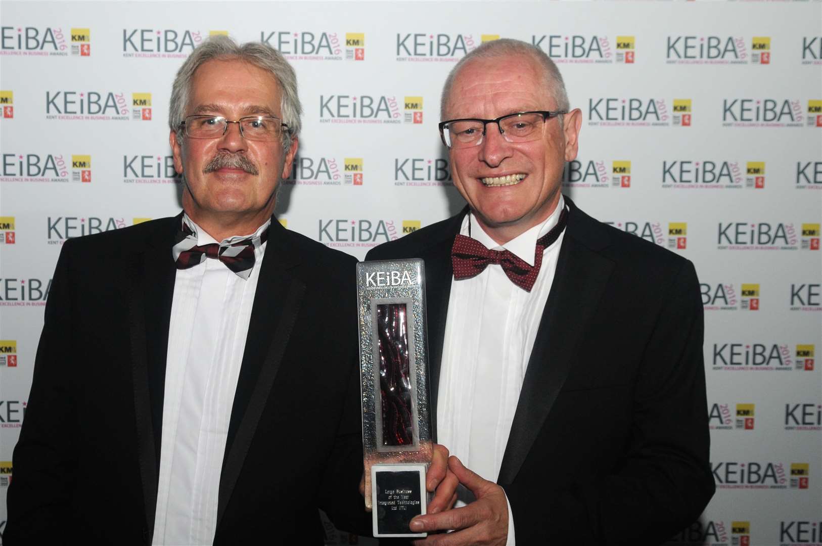 Greg Smith and Tom Cole with the Large Business of the Year trophy won by their firm ITL