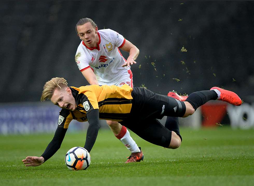 Joe Pigott in the thick of things for Maidstone at MK Dons Picture: Ady Kerry